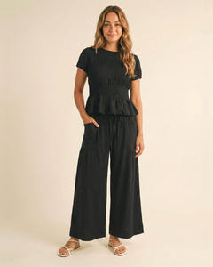 Smocked top and wide-leg pants set in black, full length