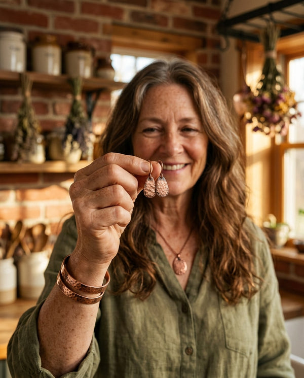 Woman wearing copper earrings & bangles
