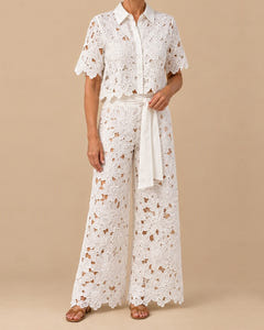Coralie lace set in white, front: collared lace shirt and high-waisted wide-leg trousers with tie belt