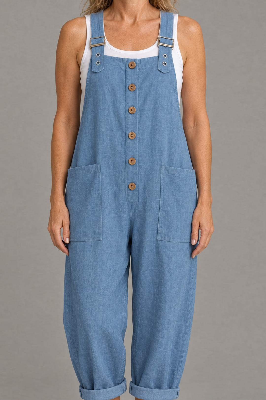 Close-up of the buttons, buckled straps, patch pockets and linen-look weave