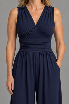 Close-up of the gathered V-neck, ruched waist and side pocket