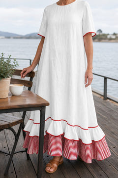 White striped hem maxi dress at a seaside cafe