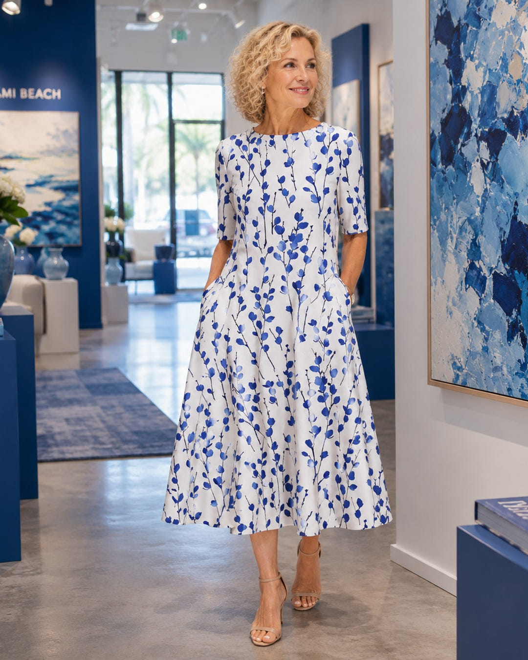Blue floral midi dress, hands in the side pockets