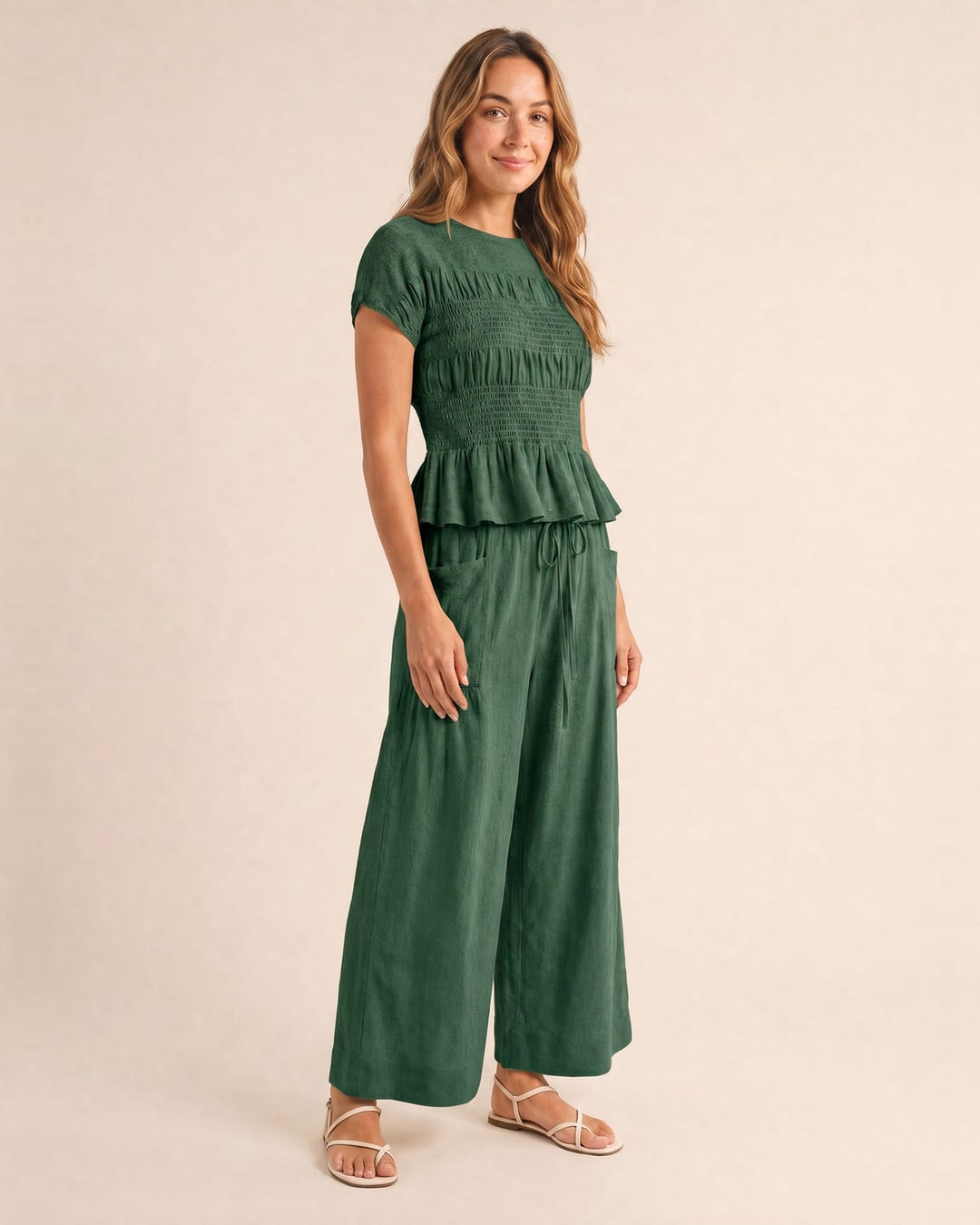 Smocked top and wide-leg pants set in sage, walking
