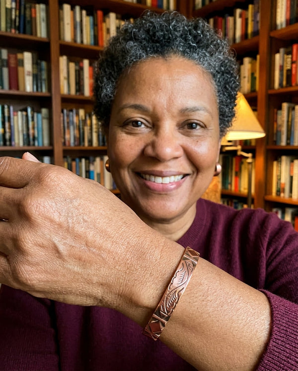 Woman wearing copper engraved cuff
