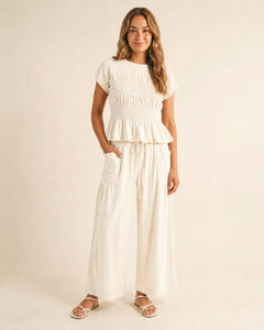 Smocked top and wide-leg pants set in cream, full length