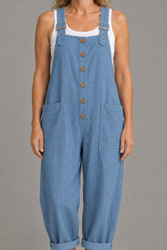 Close-up of the buttons, buckled straps, patch pockets and linen-look weave