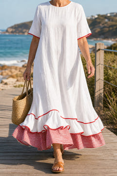 White striped hem maxi dress on a coastal boardwalk