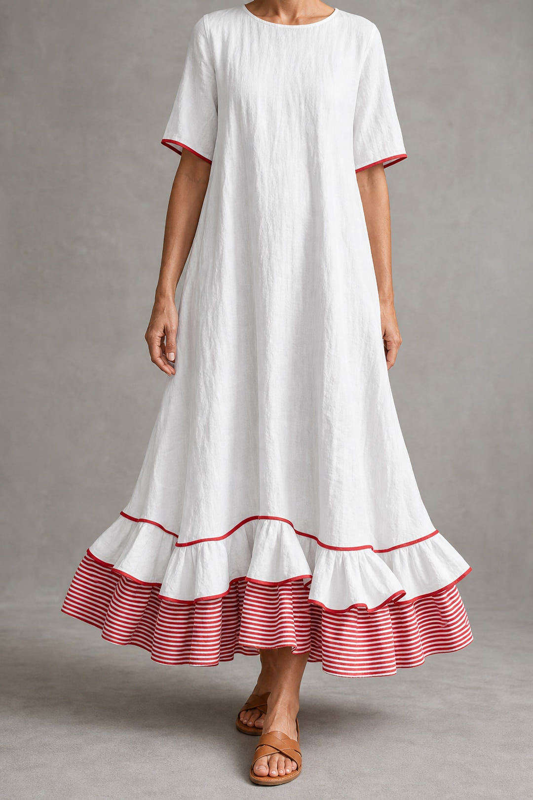 White maxi dress with a red striped ruffle hem, full length