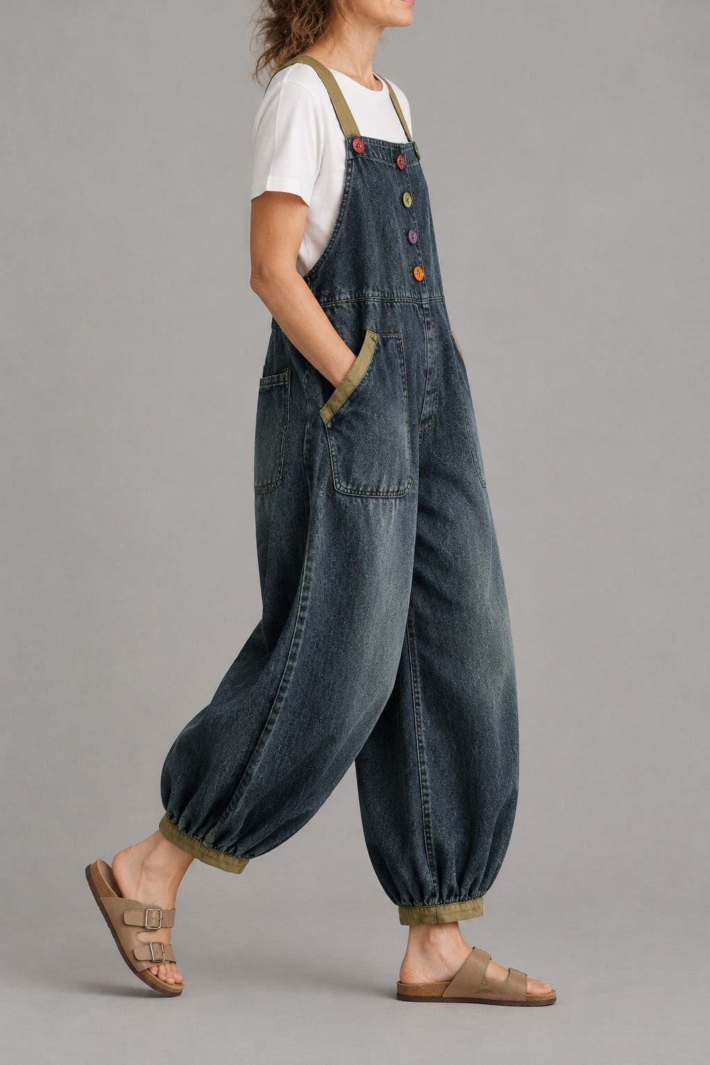Balloon-leg denim overalls from the side, legs gathered at the ankle