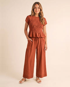 Smocked top and wide-leg pants set in rust, full length