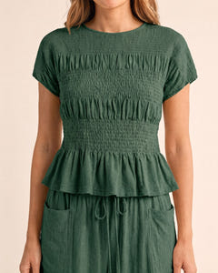 Smocked top and wide-leg pants set in sage, close-up of the smocked top